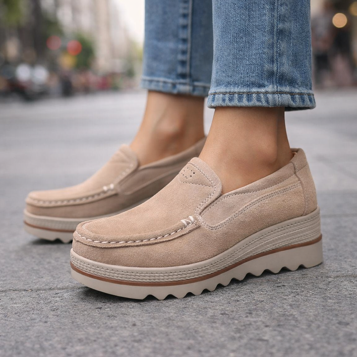 Pair of black suede platform loafers for women, slip-on comfort and versatile casual footwear