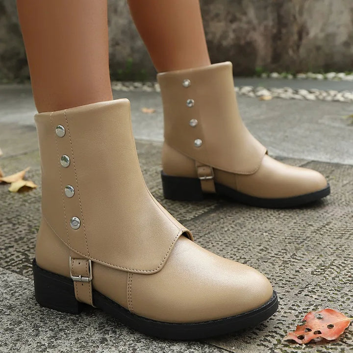 Women's versatile black vegan leather ankle boots, a must-have for winter and fall wardrobes.