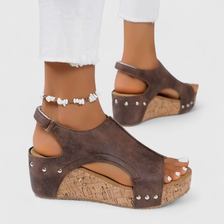 Women's wedge sandals with arch support and cushioned sole. Comfortable walking shoes for all-day summer style.