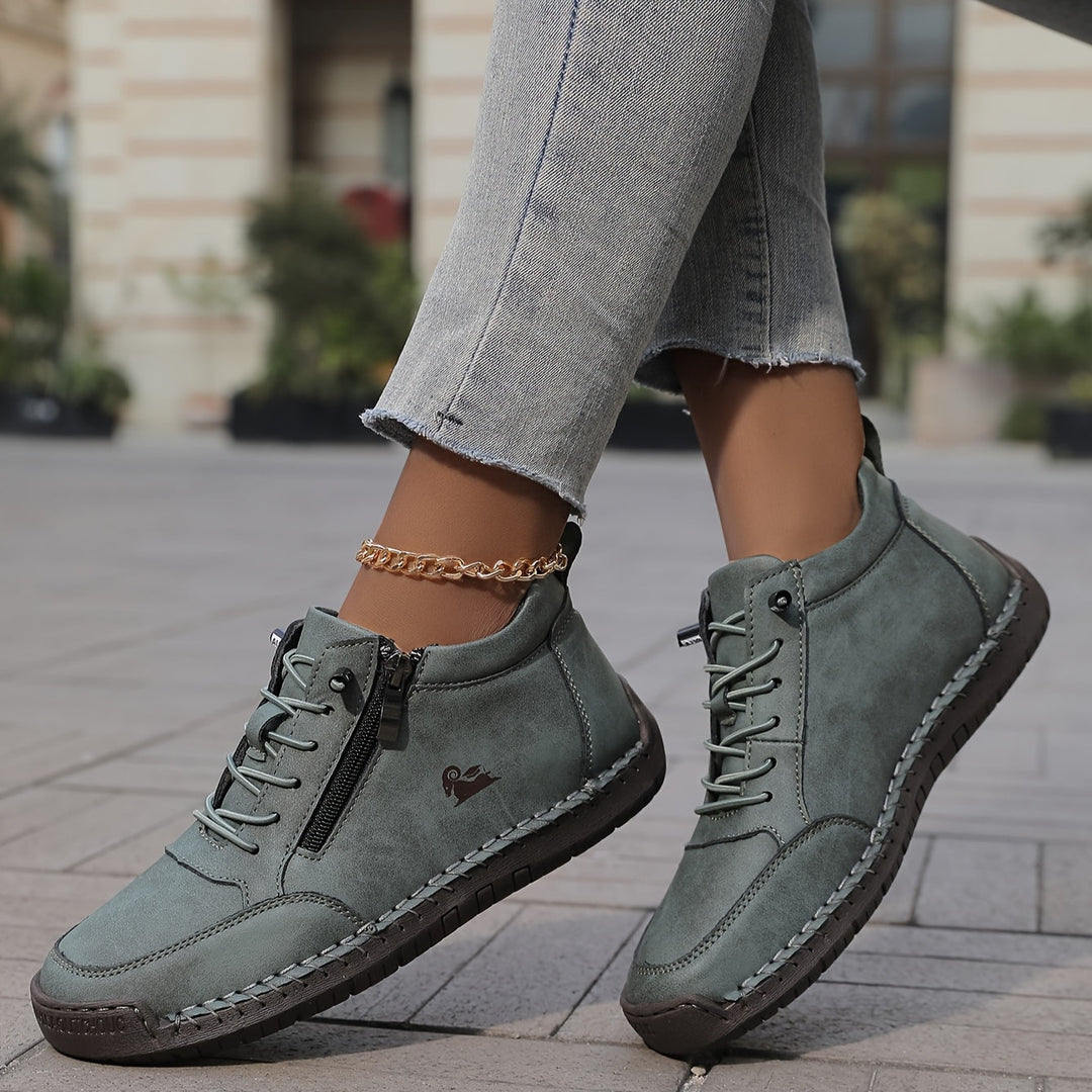 Women's comfortable black zip-up walking sneakers for everyday wear, lightweight and supportive.