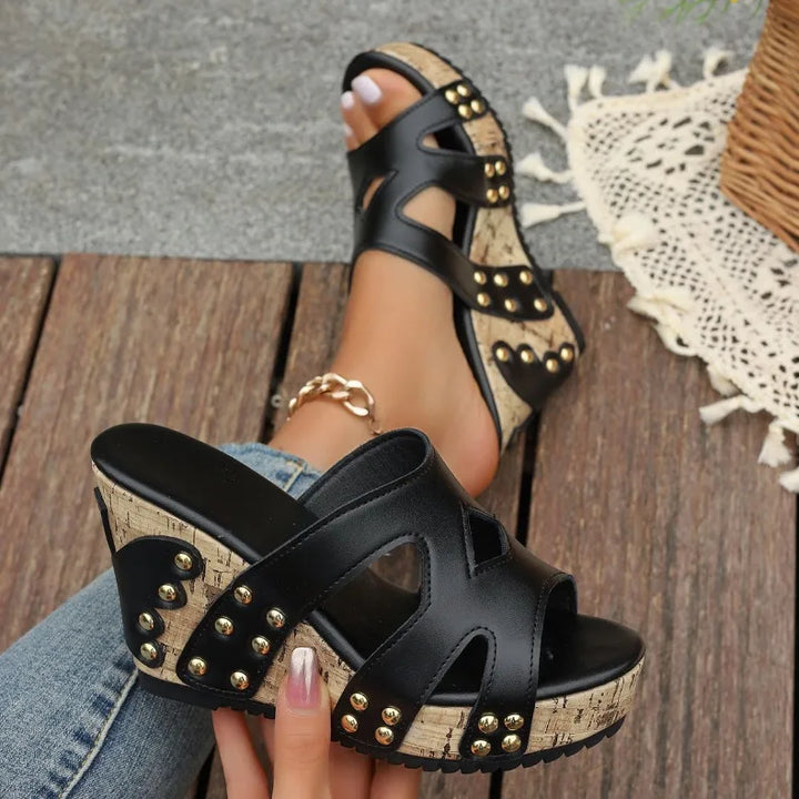 Side view of a women's casual wedge sandal, highlighting the cushioned base and stable platform for comfort.