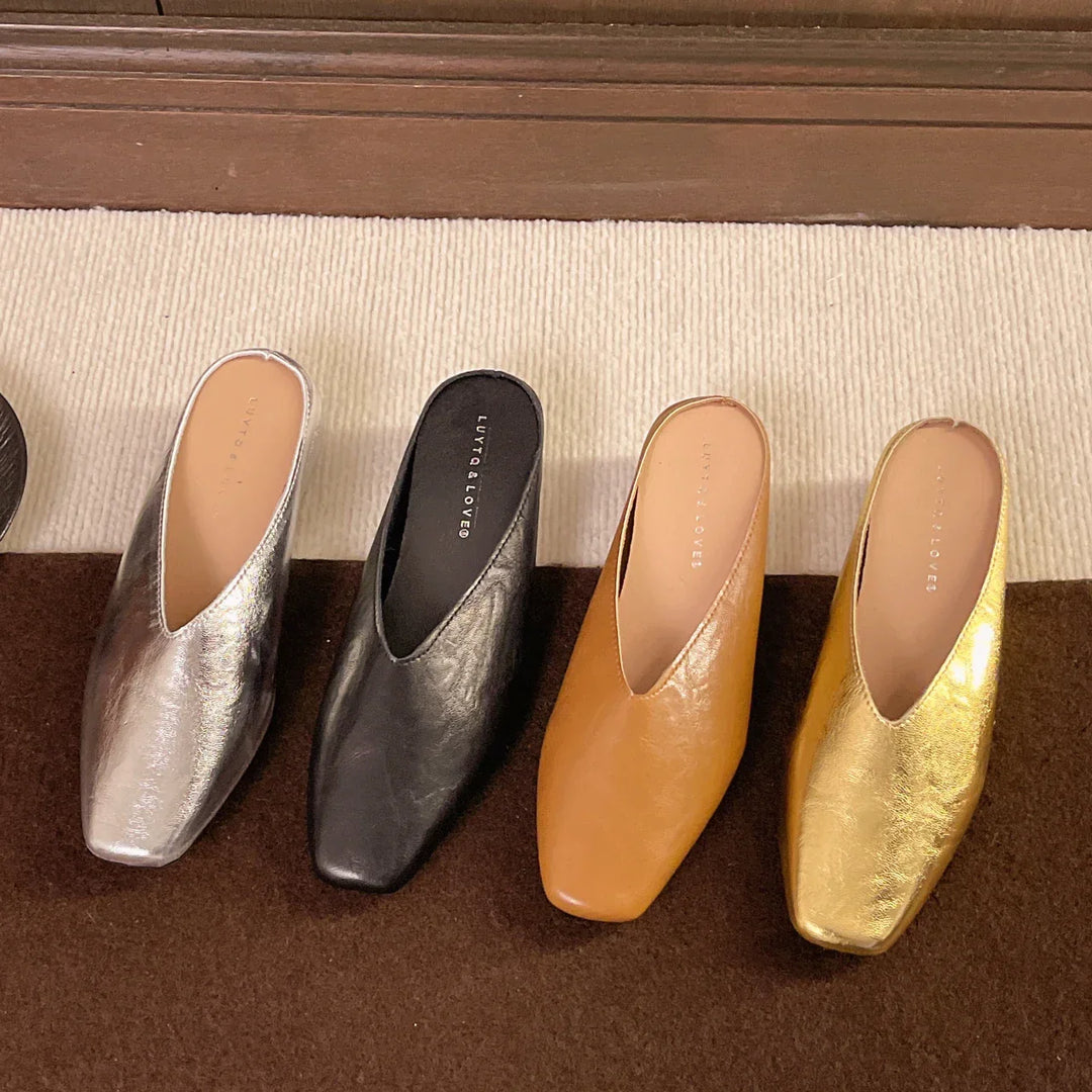 Everyday silver women's flats, comfortable slip-on style in vegan leather for casual chic looks.