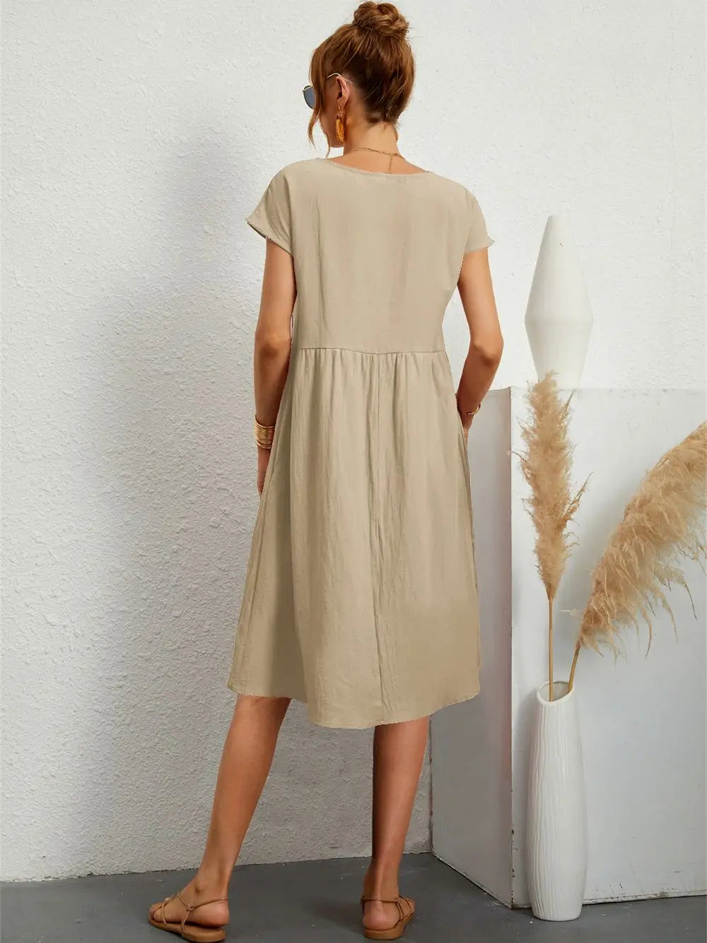 Soft, comfortable women's midi dress with a relaxed fit and essential pockets for convenience.