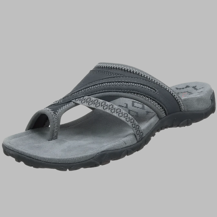 Fashionable women's cross strap sandals. Versatile slip-on flip-flops for summer, beach, or casual comfort.