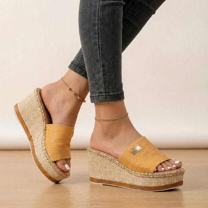 Stylish women's espadrille wedge sandals with comfortable textured straps, ideal for casual summer fashion.