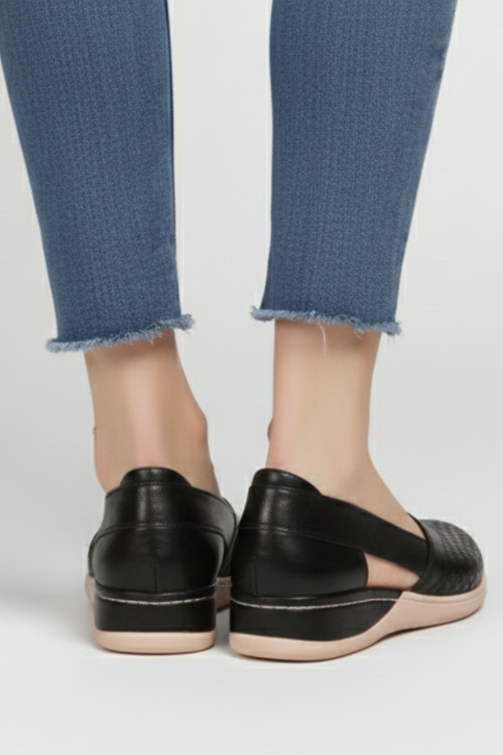 Stylish women's walking shoes, comfortable and stable with unique cut-out details for daily wear.