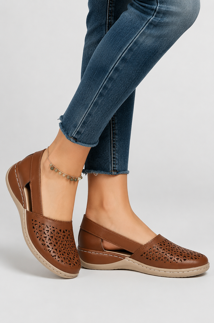 Stylish women's casual footwear featuring unique cut-outs. Comfortable & stable for all-day wear.