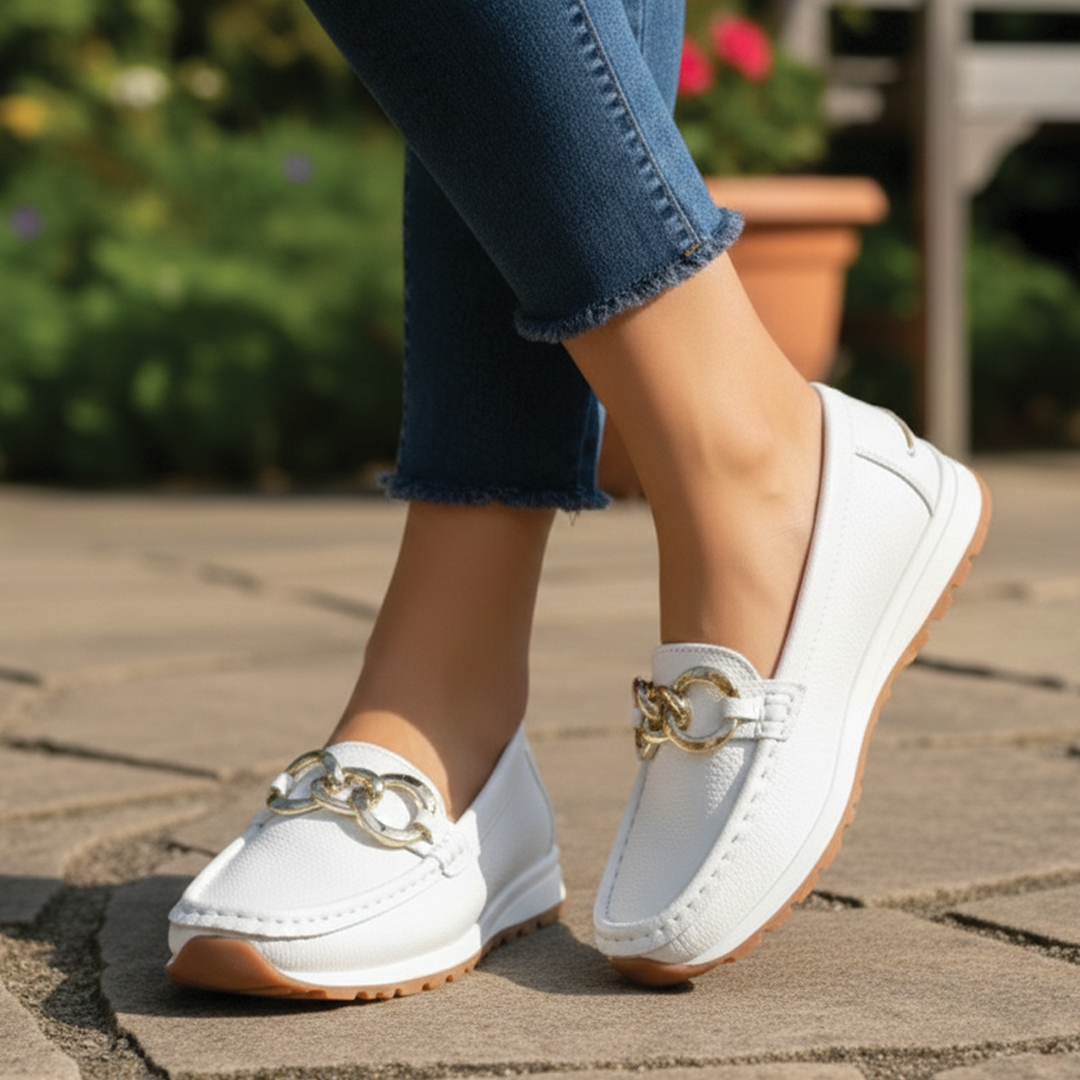 Stylish blue women's flat buckle loafers. Comfortable slip-on shoes for casual and everyday fashion.