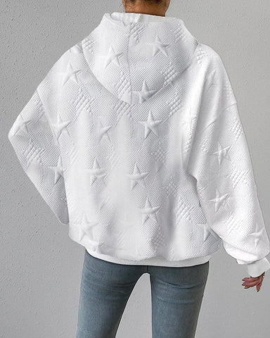 Close-up of a women's pullover hoodie with subtle star embossing, luxurious soft fabric and comfortable design