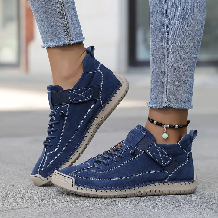 Back view of women's lace-up fashion sneakers, showing heel support and branding details.