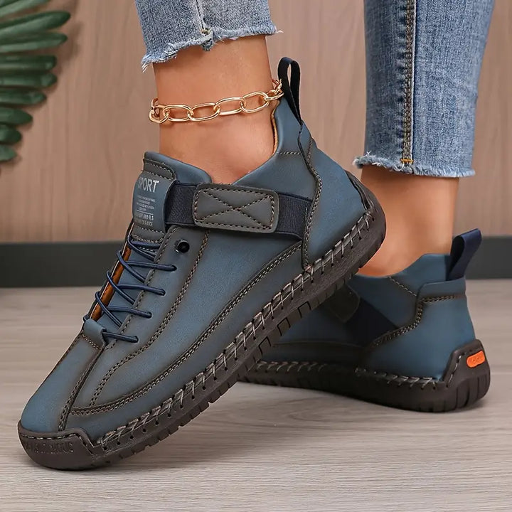 Women's walking shoes on a model's feet, demonstrating their stylish fit and comfort.
