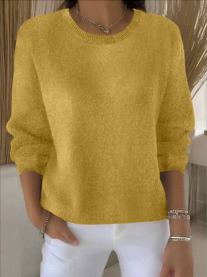 Women's comfortable loose-fit spring knit sweater in light pastel, perfect for casual everyday wear
