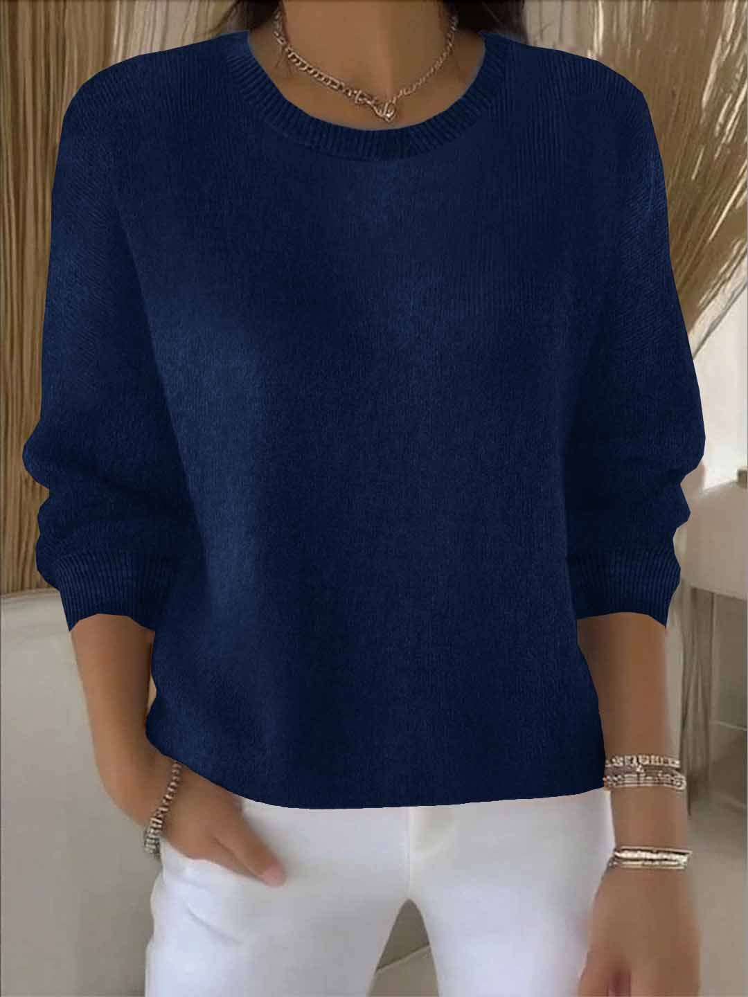 Elegant women's loose-fit spring sweater draped, showcasing its casual and relaxed silhouette