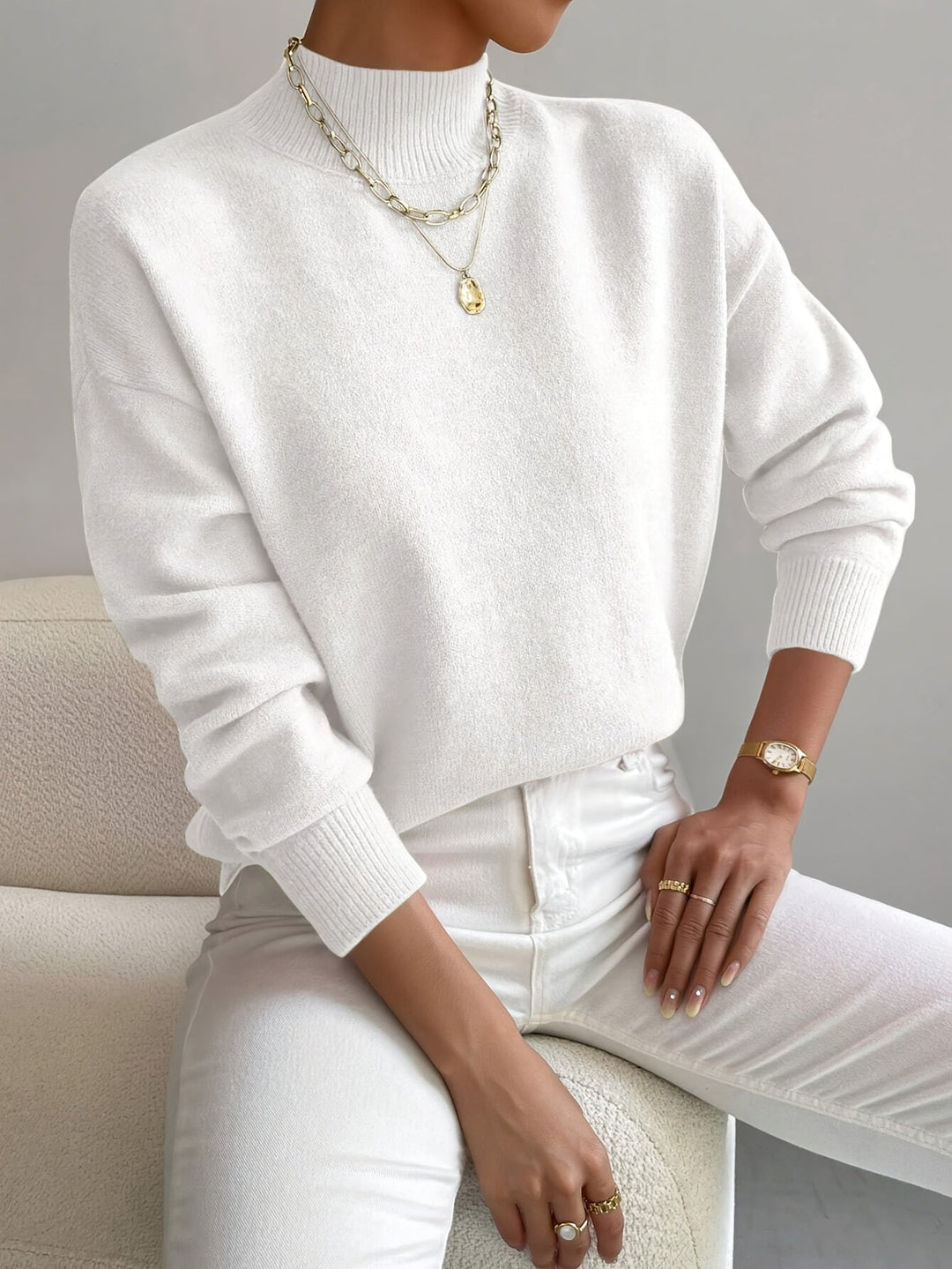 Mock neck knit sweater for women, ideal for spring fashion, with long sleeves and a relaxed fit.