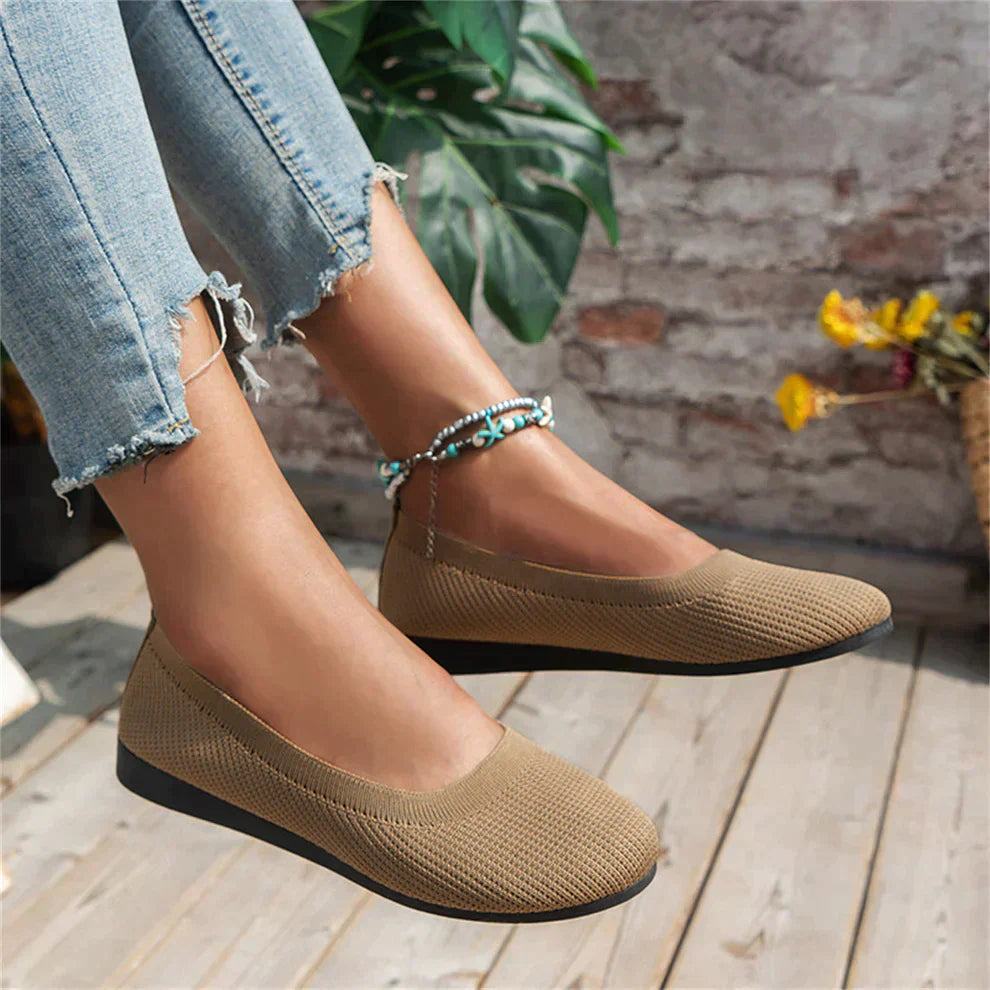 Pair of women's comfortable navy ballet flats, great for spring and casual outfits.