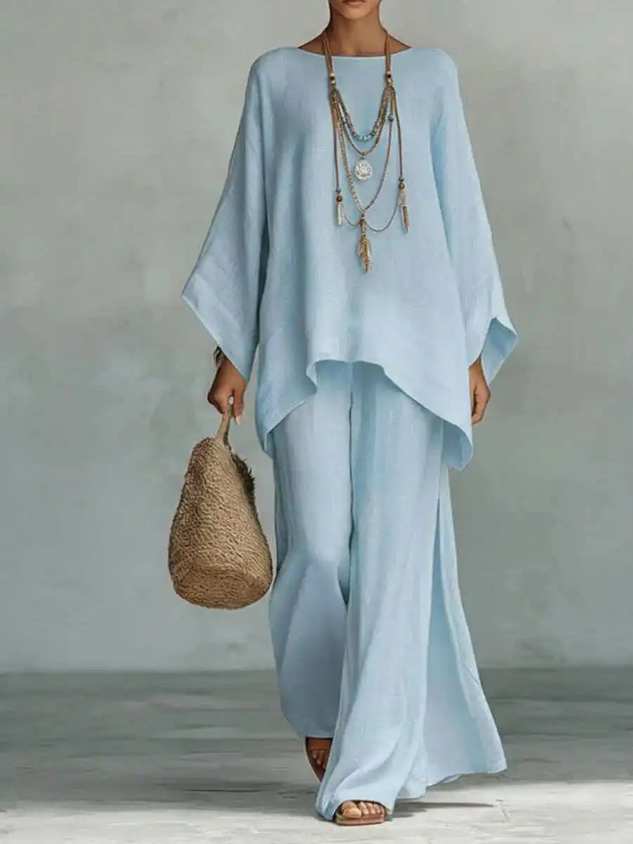 Women's linen two-piece set: relaxed fit top and flowy wide-leg pants, ideal for comfortable summer style.