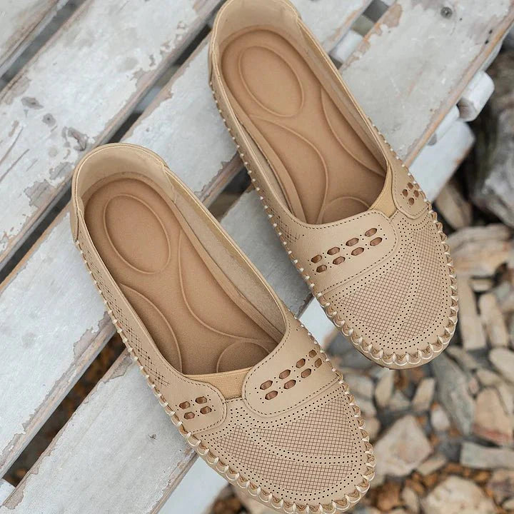 Comfortable women's perforated slip-on loafers, ideal for everyday casual wear with flat sole.