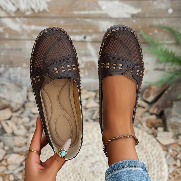 Lightweight women's orthopedic slip-on loafers with perforated design for breathable comfort.