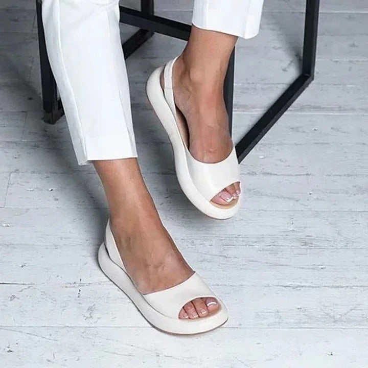 Women's comfortable slip-on sandals with open toe and elastic band for easy summer wear.