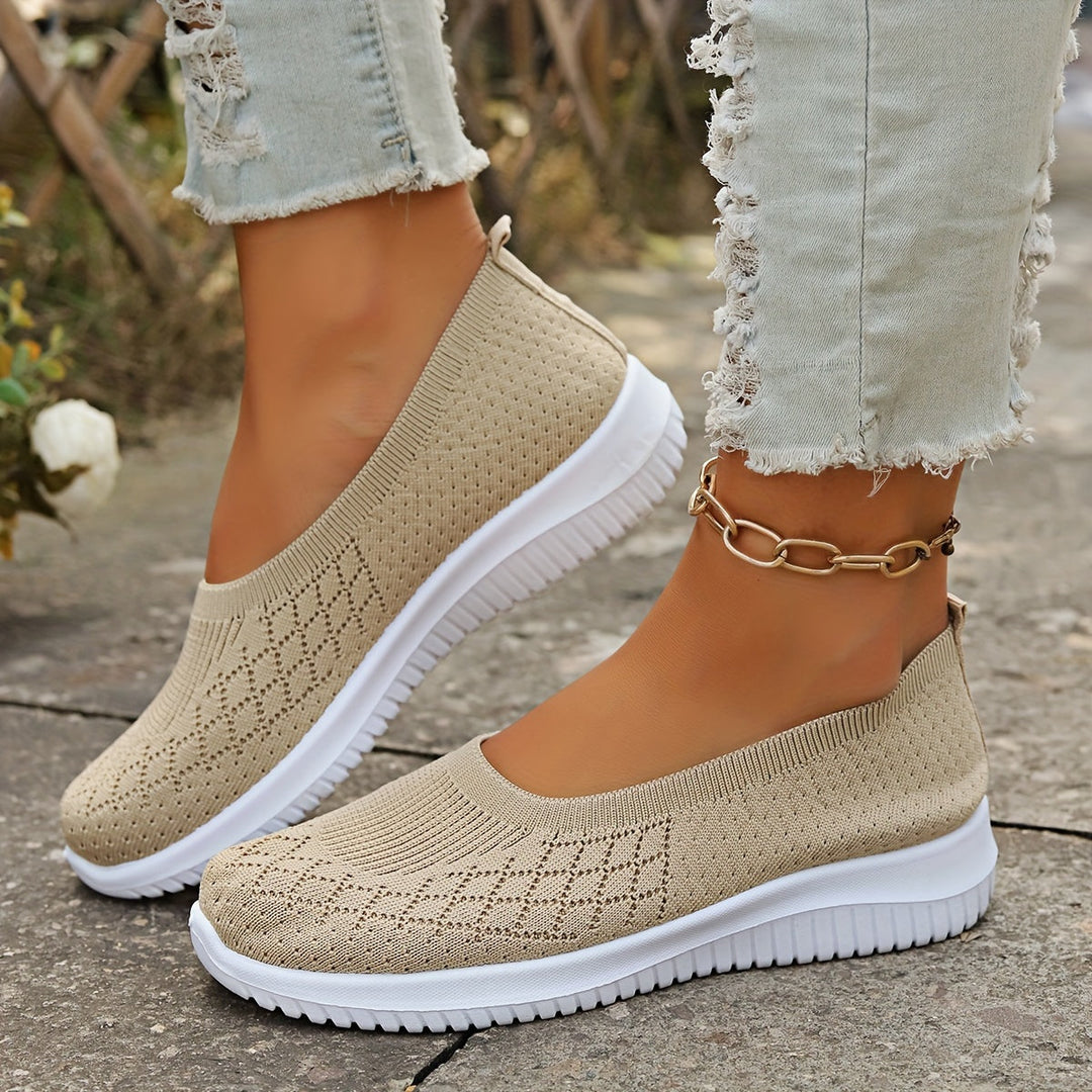 Stylish women's slip-on shoes, perfect for casual everyday wear. Comfortable and modern walking footwear.