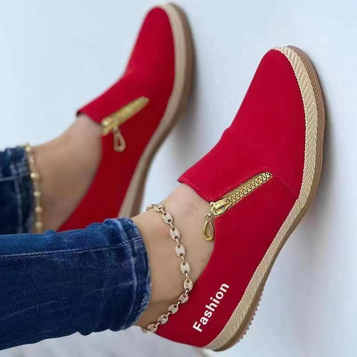 Stylish women's slip-on sneakers with a breathable upper, offering lightweight comfort for walking & casual use.