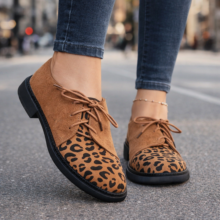 Close-up of the soft suede texture on women's lace-up flats, highlighting comfort.
