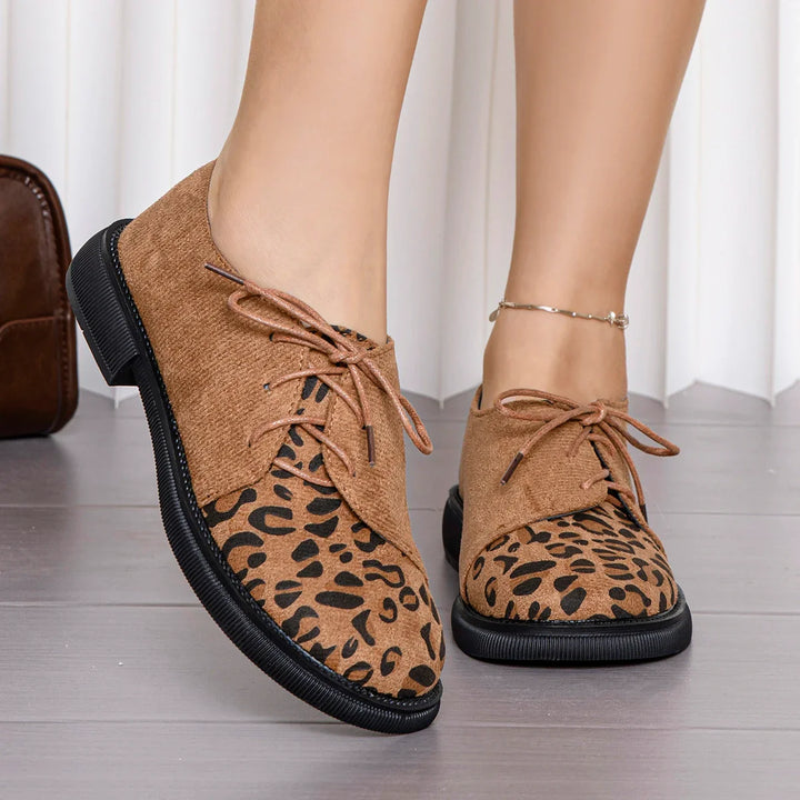 Side view of comfortable women's lace-up flats, showcasing the shoe's profile.