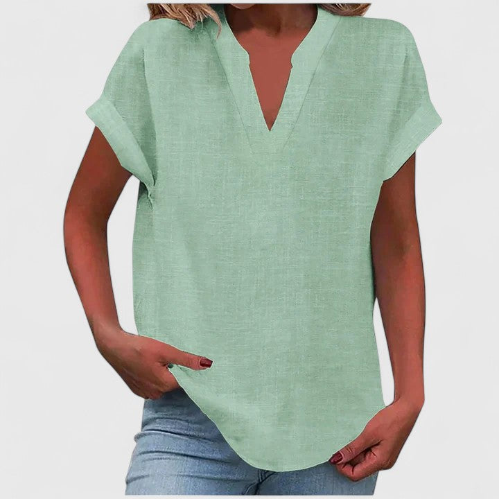 Flowy V-neck women's blouse, comfortable short sleeve top for a relaxed yet elegant casual fashion statement.
