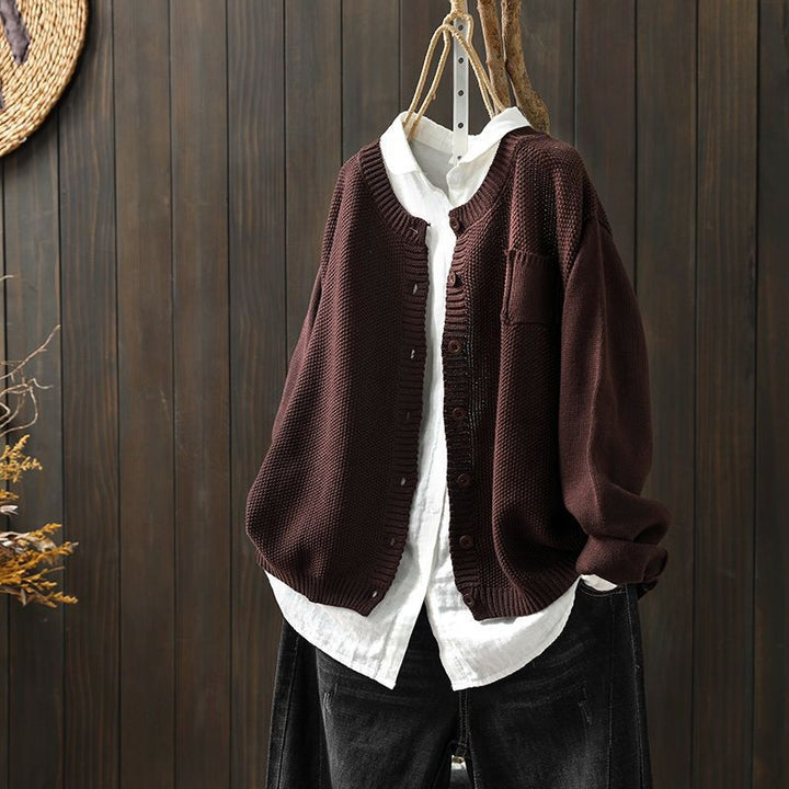 Women's comfy cream knit cardigan with button detail and relaxed fit, perfect for layering.