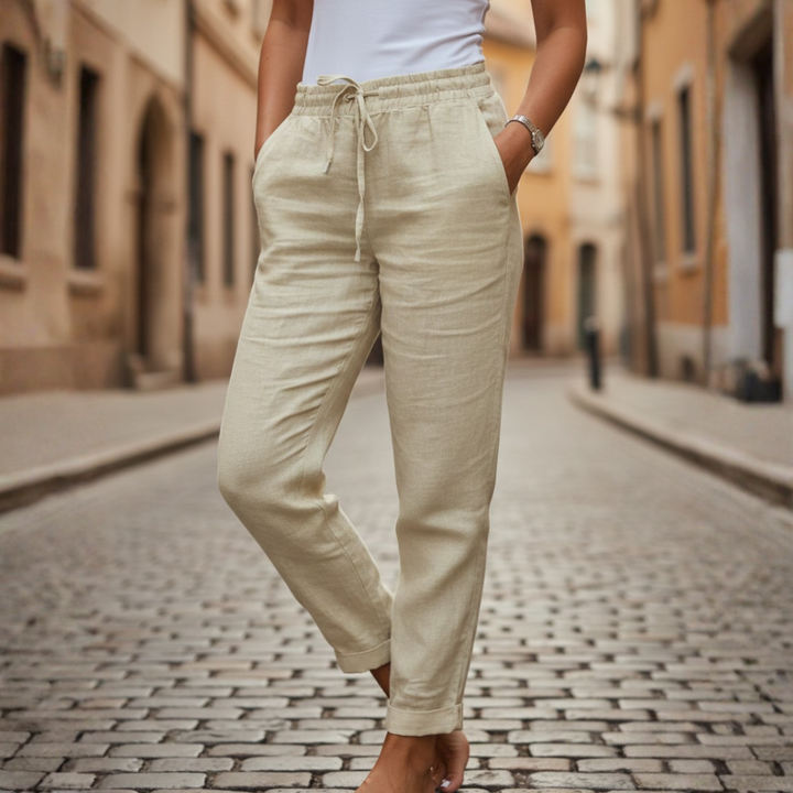 Casual women's summer drawstring pants with tapered leg & pockets, ideal for relaxing or daily wear.