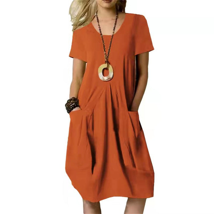 Casual women's short sleeve pocket swing dress. Soft, comfy fabric, knee-length, perfect for summer days.