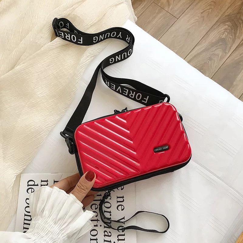Organize essentials with this women's hard shell mini crossbody bag, great for travel and daily tasks.