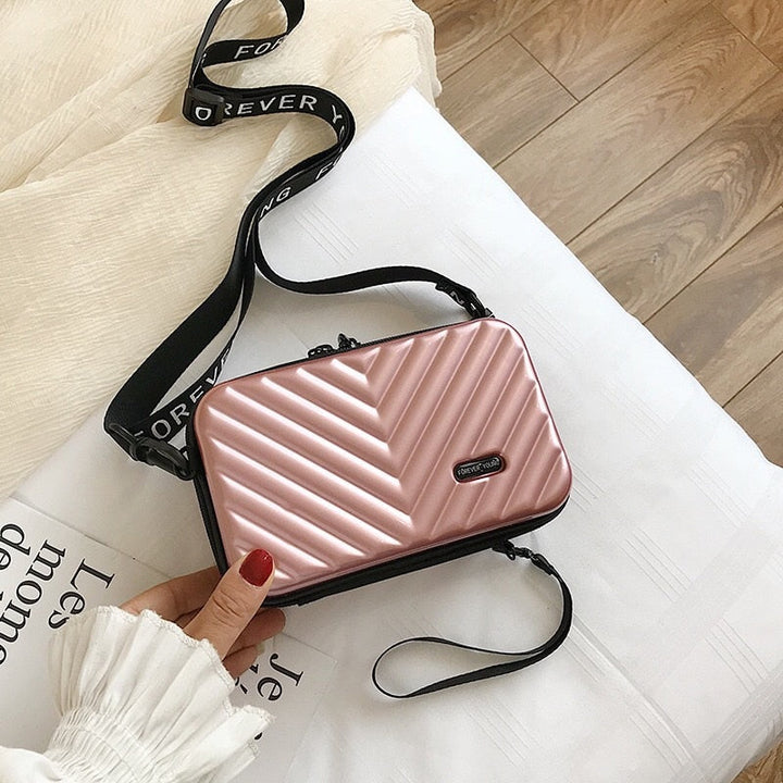 Durable PVC hard shell mini crossbody purse for women, ideal for secure and organized travel.