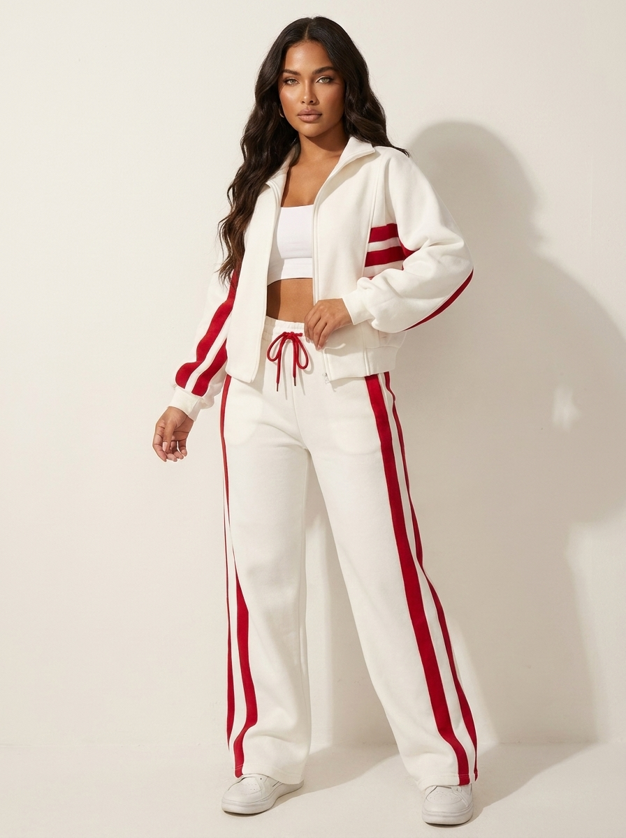 Stylish women's zip-up tracksuit jacket with contrast stripes. Perfect for sporty casual wear.