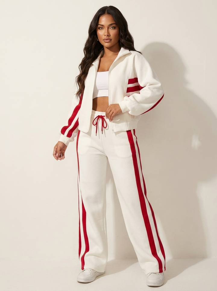 Stylish women's zip-up tracksuit jacket with contrast stripes. Perfect for sporty casual wear.