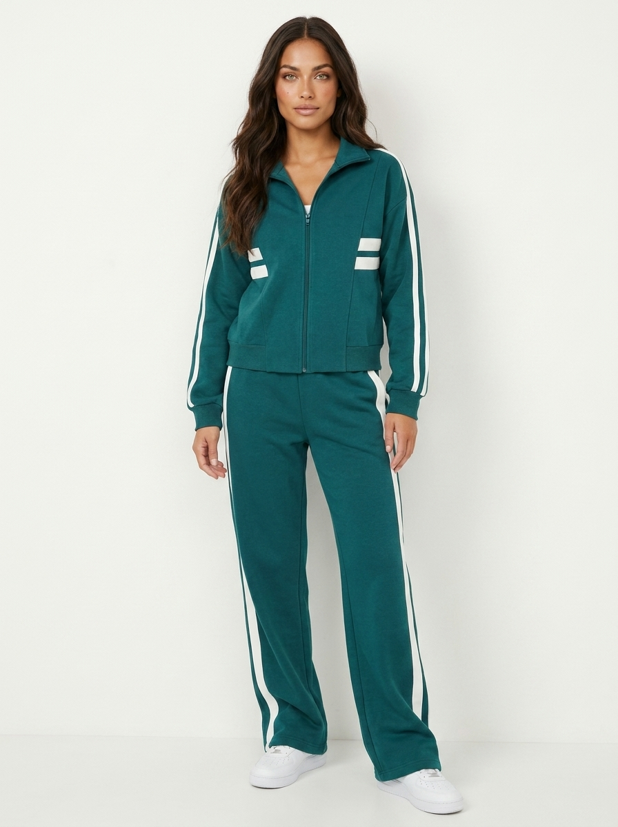 Full women's coordinated tracksuit set featuring a zip-up top & wide leg trousers. Casual & chic loungewear.
