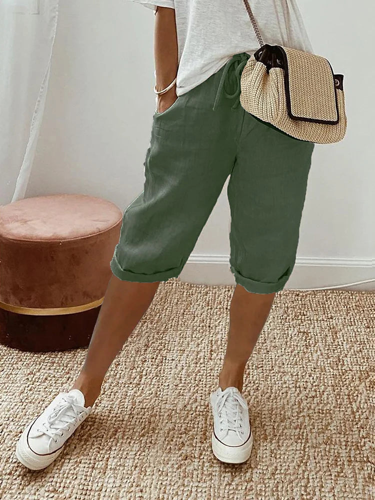 Stylish women's drawstring cotton capri pants with a roll hem. Ideal for casual wear, summer, & everyday comfort.