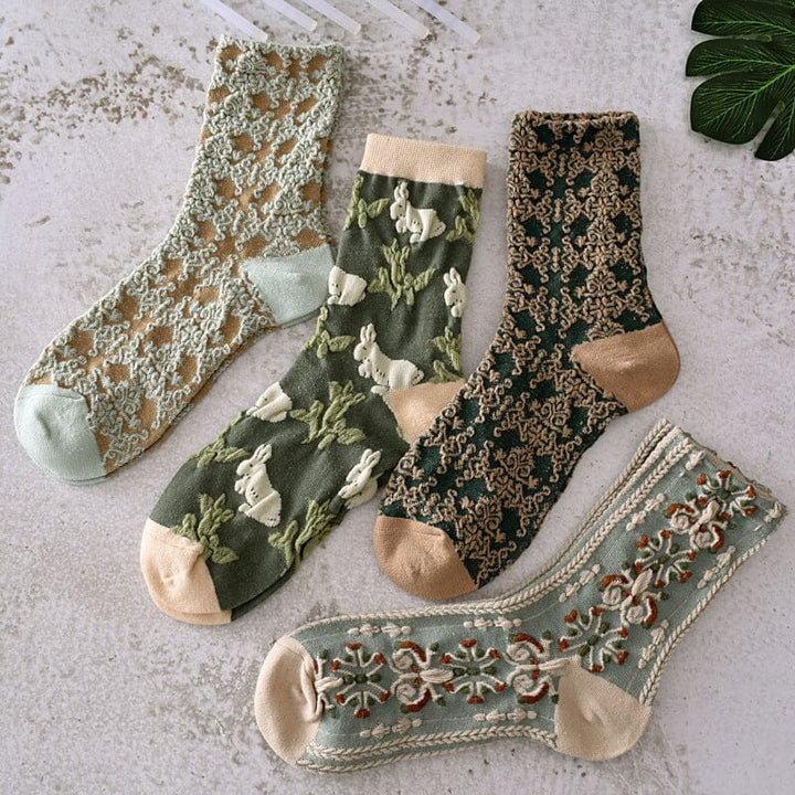Overhead shot of women's vibrant floral cotton socks laid flat, highlighting their intricate print