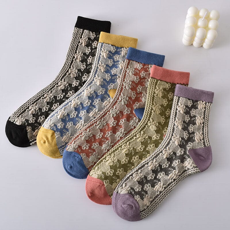Artistic shot of women's floral cotton socks hanging, showcasing the flow and pattern of the fabric