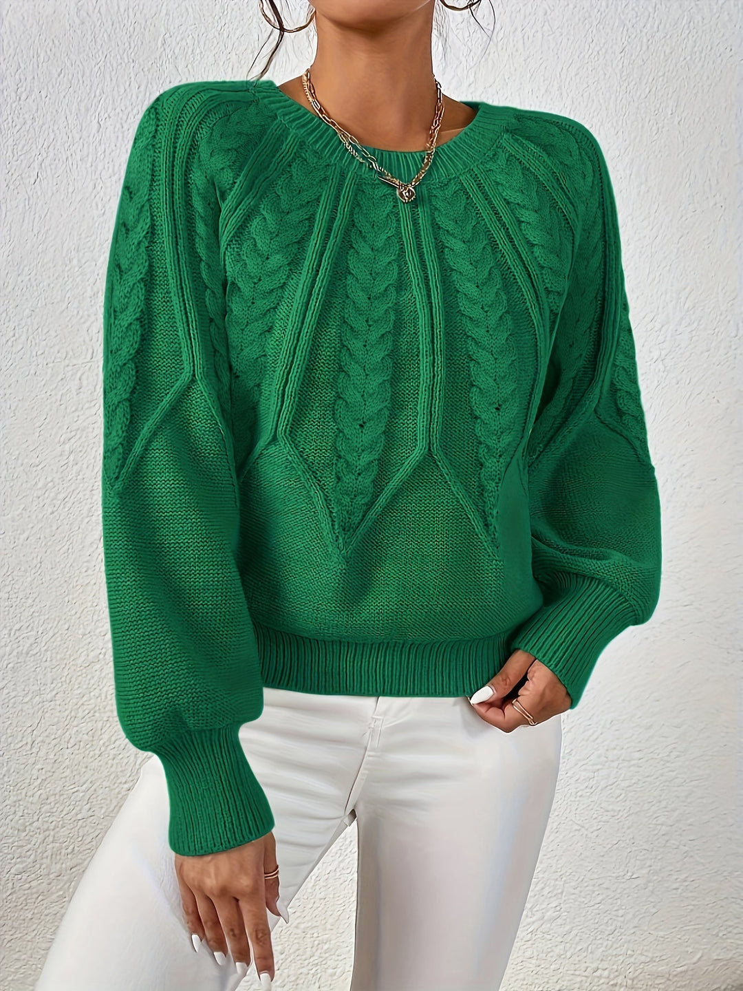 Relaxed fit women's cable knit sweater, soft hand-feel, great for chilly weather.
