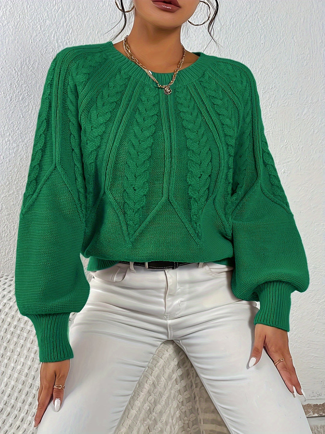 Stylish women's relaxed fit sweater, cable knit design, perfect for layering.