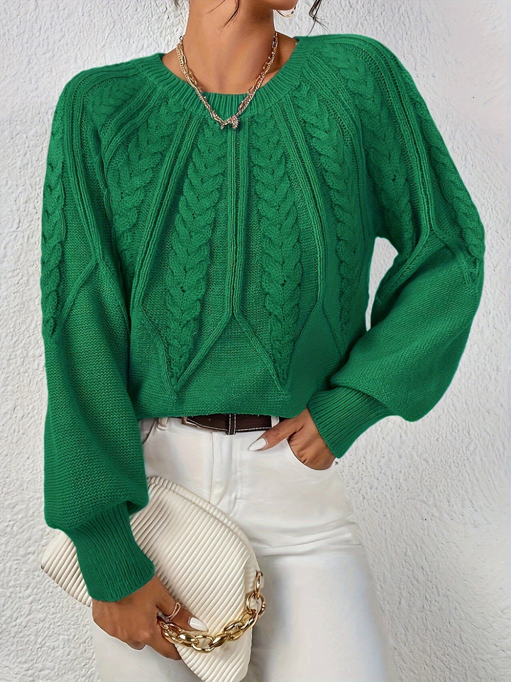 Comfortable women's cable knit sweater, relaxed fit, in a classic oatmeal shade.