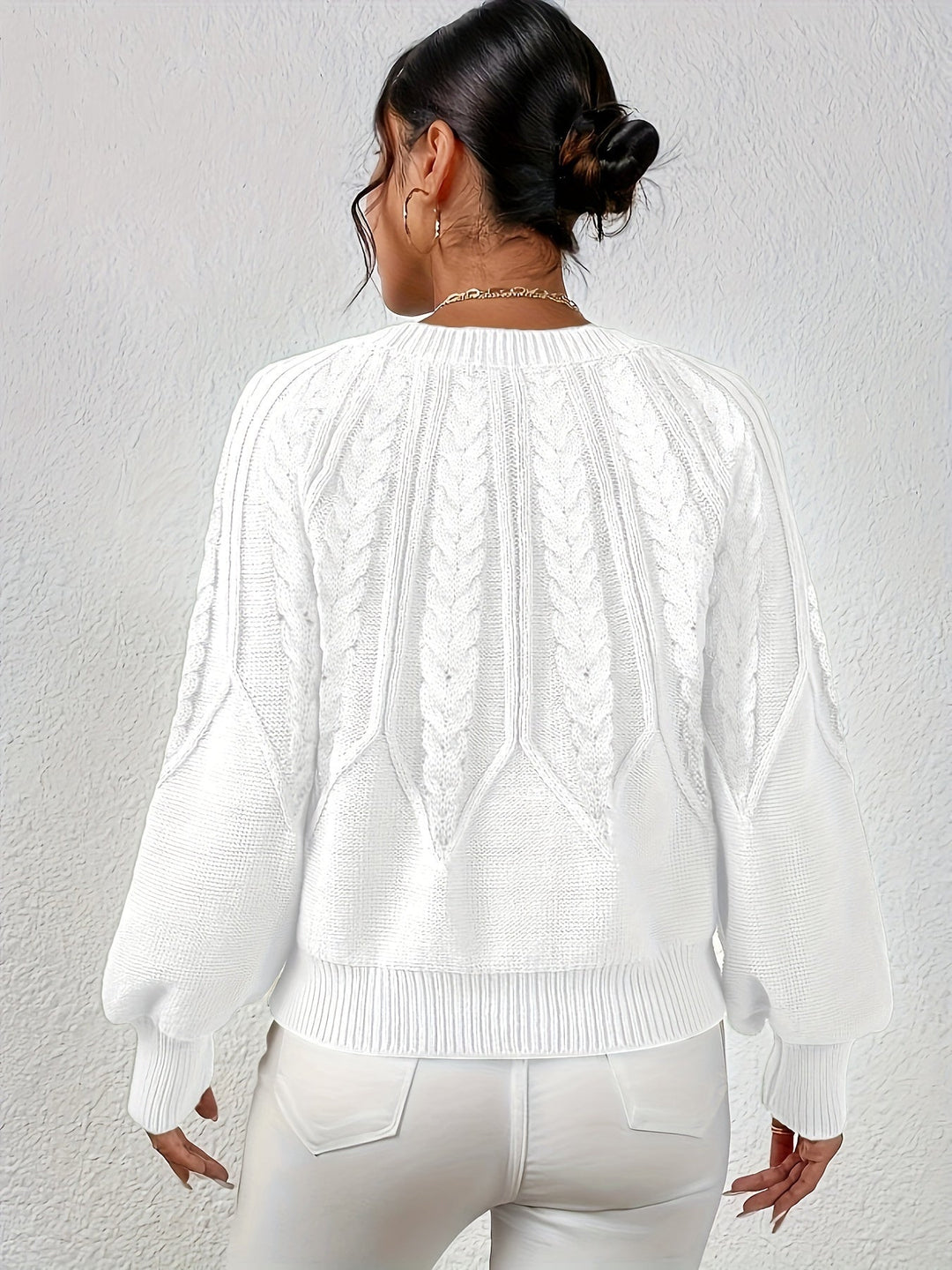 Women's cable knit sweater, relaxed fit, with detailed knit work, perfect for autumn.