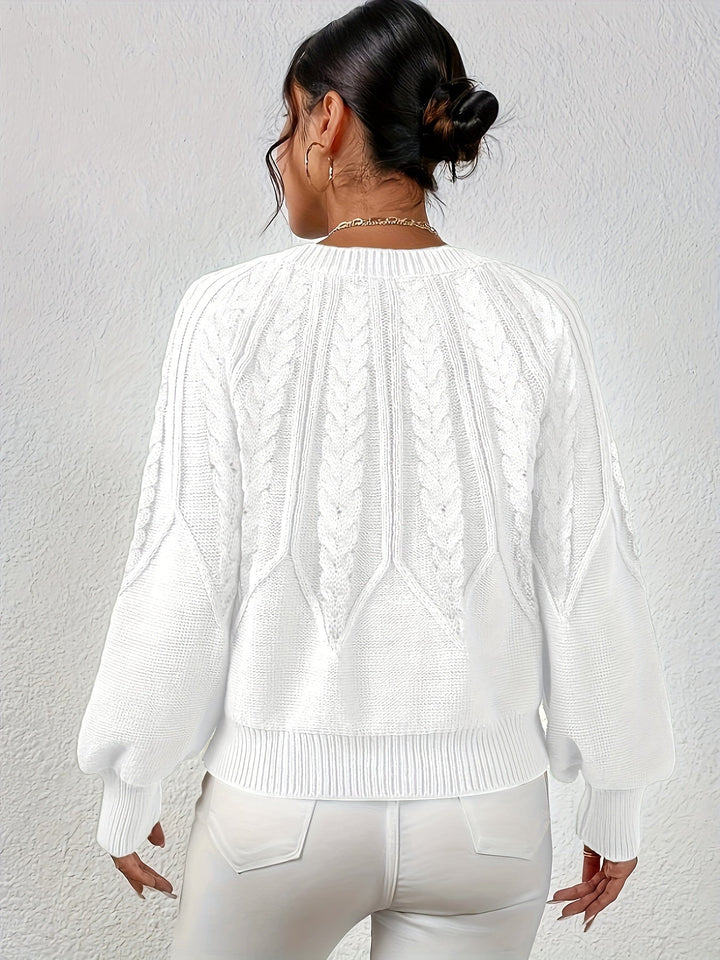Women's cable knit sweater, relaxed fit, with detailed knit work, perfect for autumn.