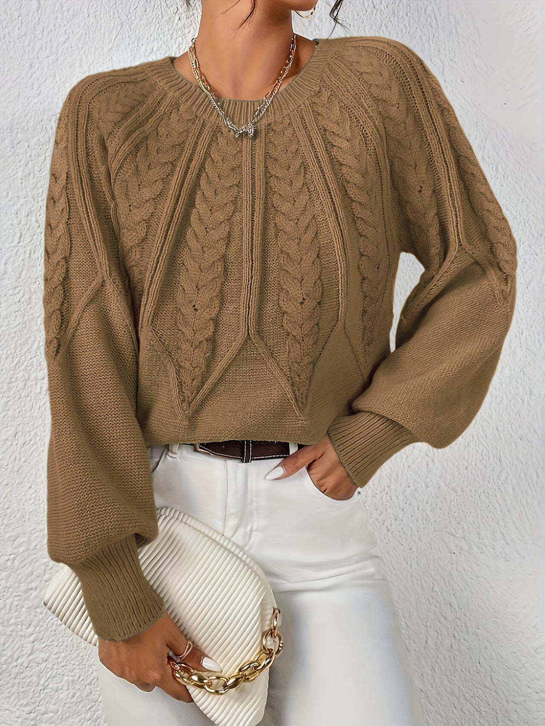 Women's soft cable knit sweater, relaxed fit, perfect for a cozy fall look.
