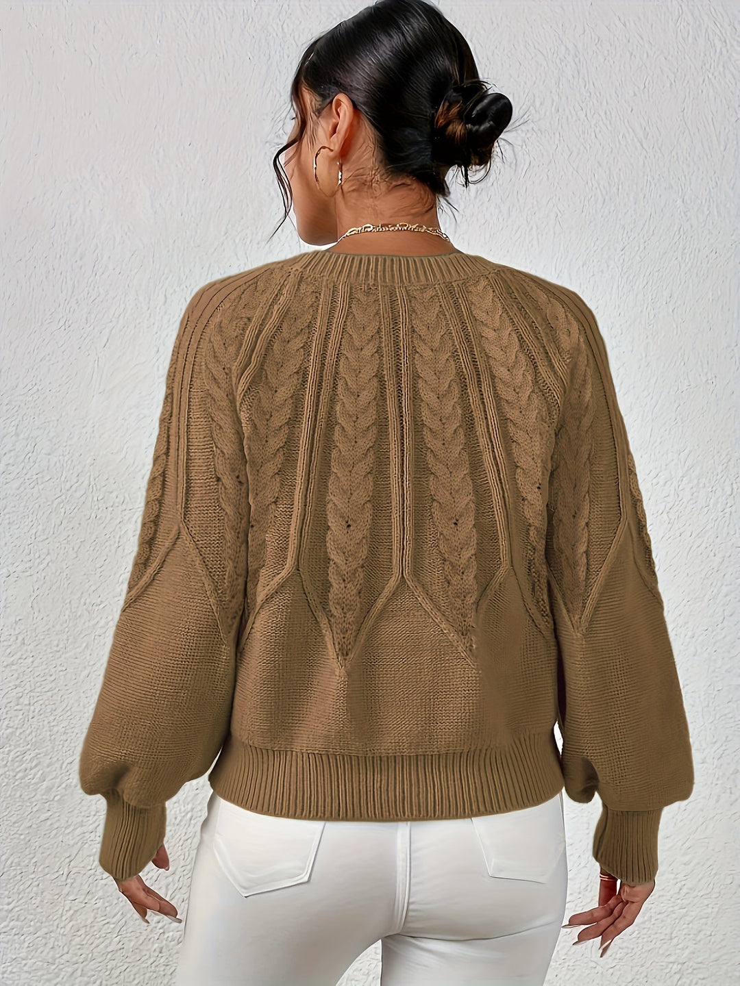 Stylish women's relaxed fit cable knit sweater, a key piece for your winter wardrobe.