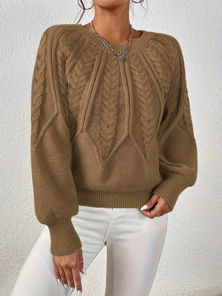 Fall women's cable knit sweater, relaxed fit, combining comfort with elegant style.