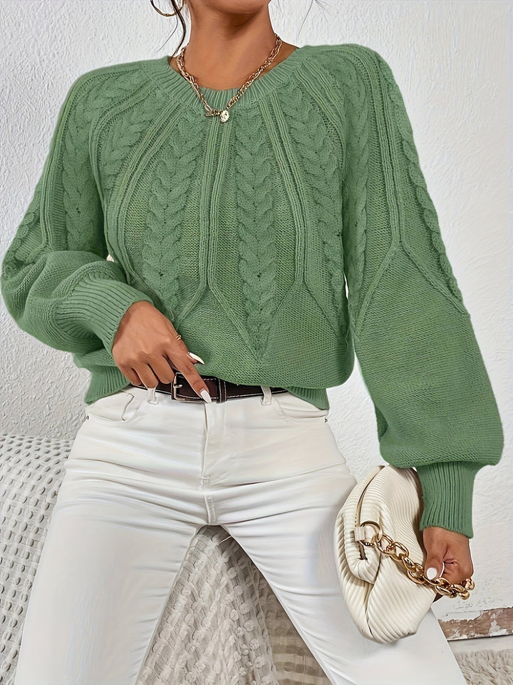Women's relaxed fit cable knit sweater, elegant design, ideal for autumn style.