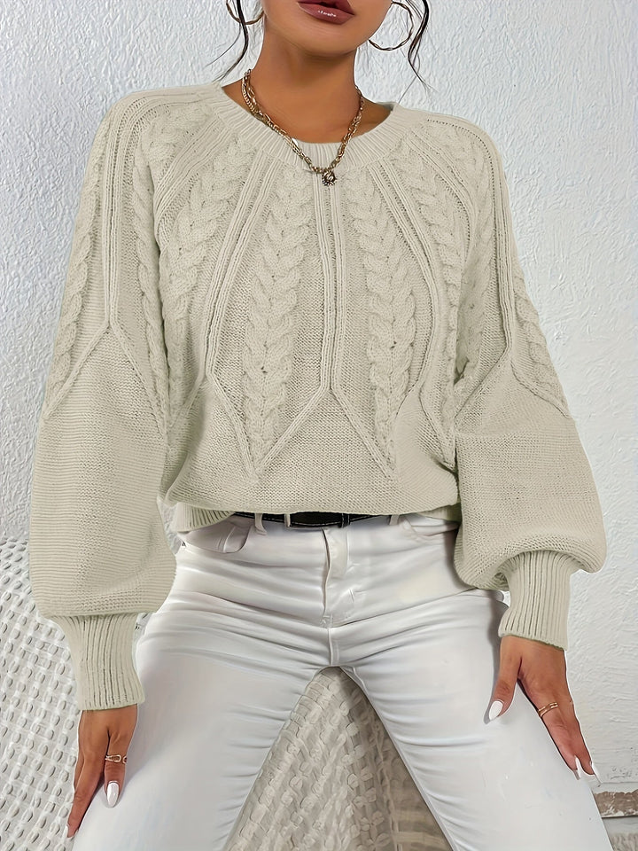 Women's stylish relaxed fit cable knit sweater, soft texture, great for layering.