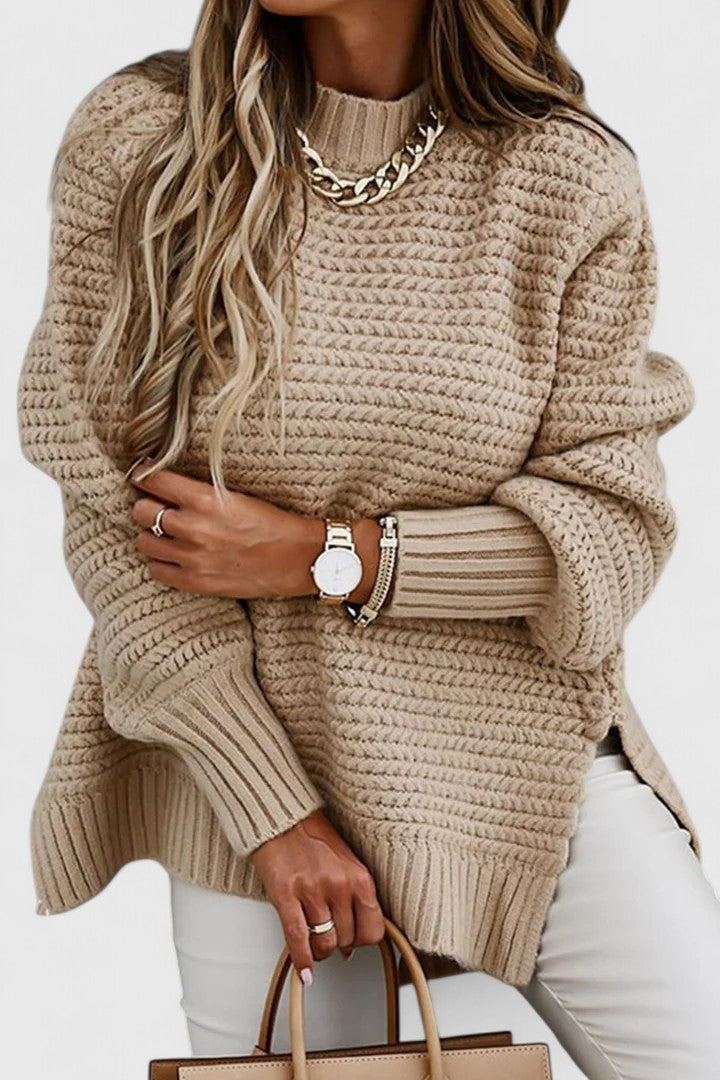Comfortable women's oversized chunky knit sweater with a cozy ribbed mock neck, perfect for winter warmth.